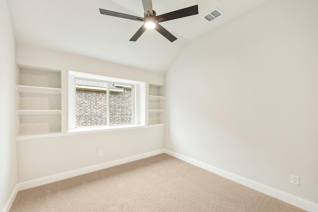 empty room featuring carpet flooring, baseboards, and visible vents