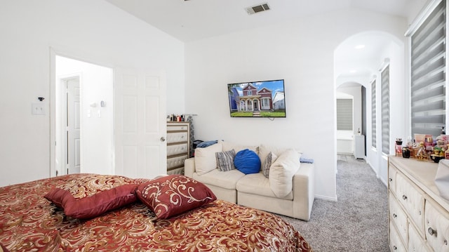 carpeted bedroom featuring vaulted ceiling