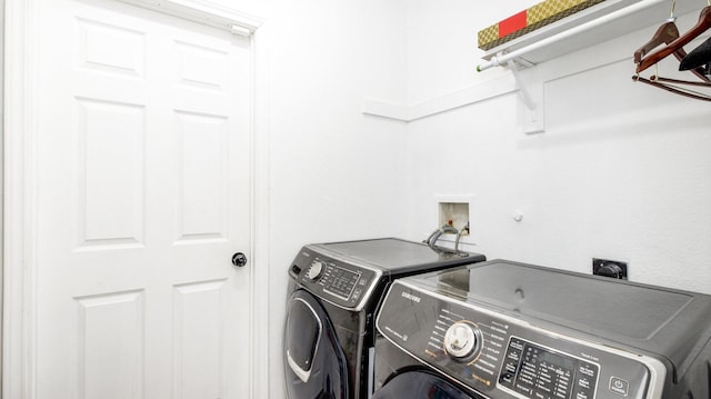 laundry area with independent washer and dryer