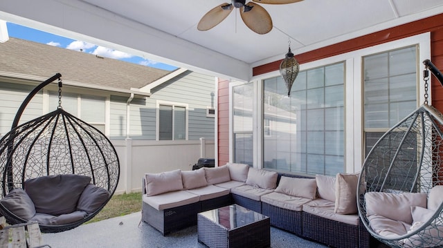 view of patio with an outdoor living space and ceiling fan