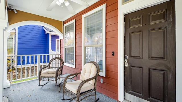 doorway to property with covered porch and ceiling fan