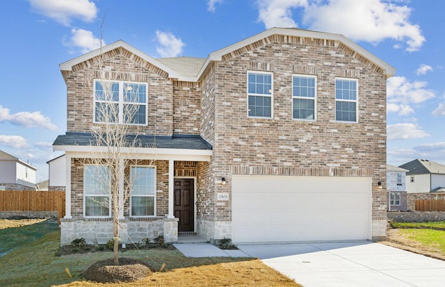 view of front of property with a garage