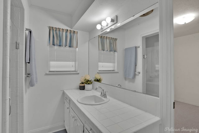 bathroom featuring vanity and a textured ceiling