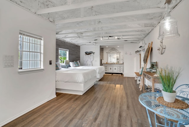 bedroom with a wall mounted air conditioner, dark hardwood / wood-style floors, and beam ceiling