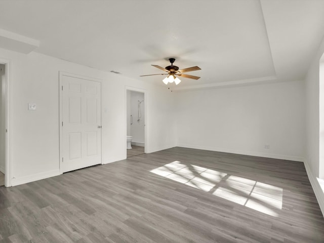 unfurnished room with hardwood / wood-style floors and ceiling fan