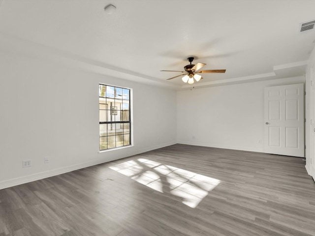 empty room with light hardwood / wood-style floors and ceiling fan