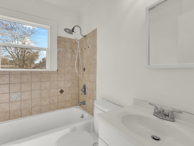 full bathroom with vanity, toilet, and tiled shower / bath