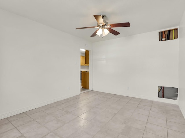 spare room with ceiling fan