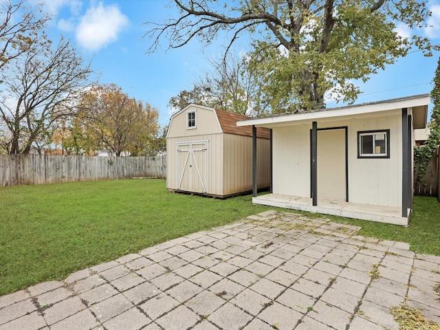 view of outbuilding featuring a yard