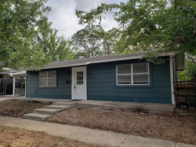 single story home with a carport