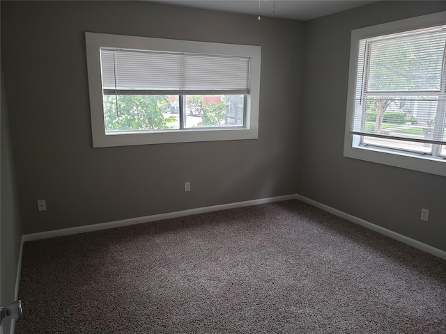 empty room with carpet flooring