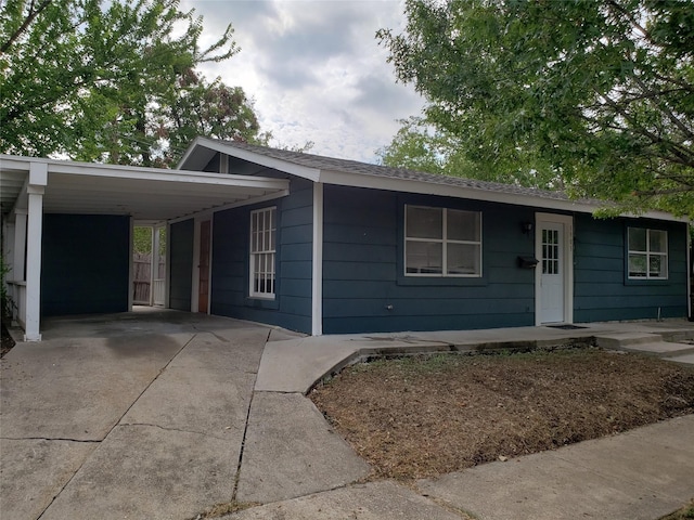 single story home with a carport