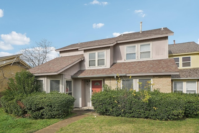 view of front of property with a front lawn