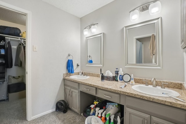 bathroom featuring vanity and a textured ceiling