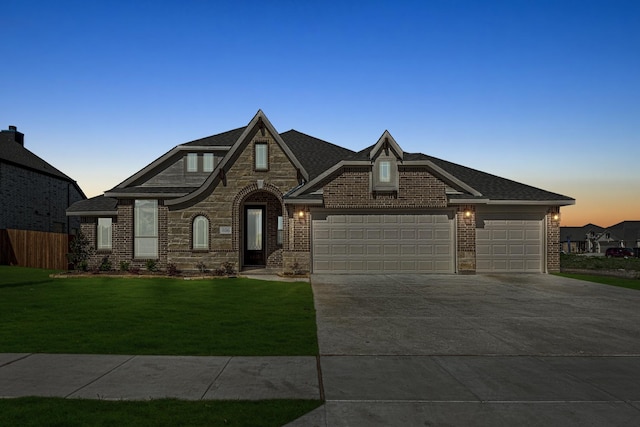 806 Willowbanks Dr, Josephine, TX 75173 - french country style house with an attached garage, concrete driveway, brick siding, and stone siding
