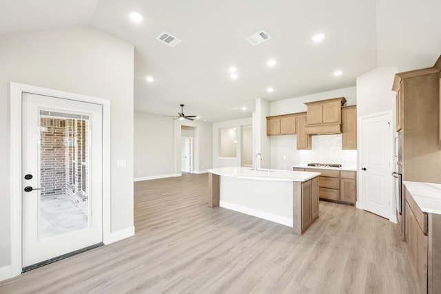 806 Willowbanks Dr, Josephine, TX 75173 - kitchen featuring a kitchen island with sink, light wood-style flooring, light countertops, a sink, and recessed lighting