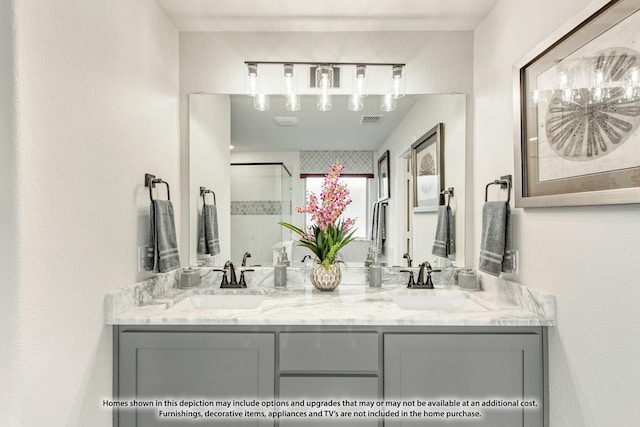 bathroom featuring vanity and a shower with shower door