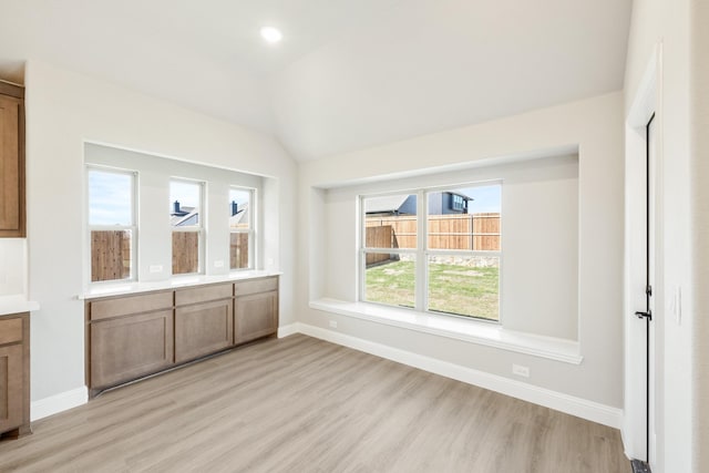 806 Willowbanks Dr, Josephine, TX 75173 - unfurnished dining area featuring light wood-type flooring, baseboards, lofted ceiling, and recessed lighting