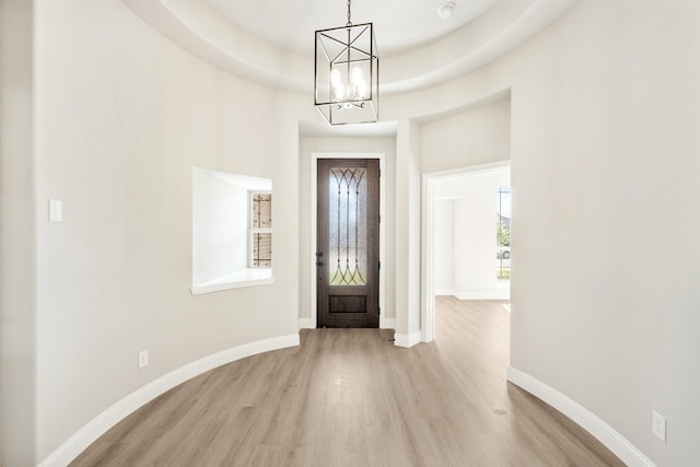 806 Willowbanks Dr, Josephine, TX 75173 - foyer entrance with a chandelier, light wood-style flooring, and baseboards