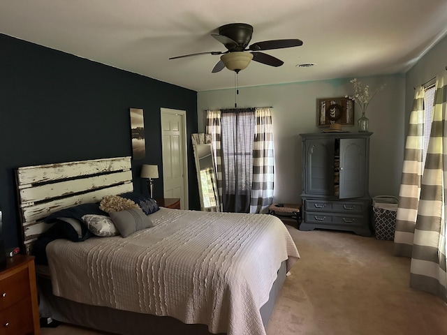 carpeted bedroom with ceiling fan