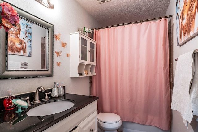 full bathroom with vanity, shower / bath combo, a textured ceiling, and toilet