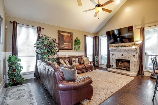 living room with dark wood-type flooring, high vaulted ceiling, and ceiling fan