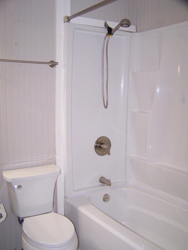 bathroom featuring shower / bathtub combination and toilet