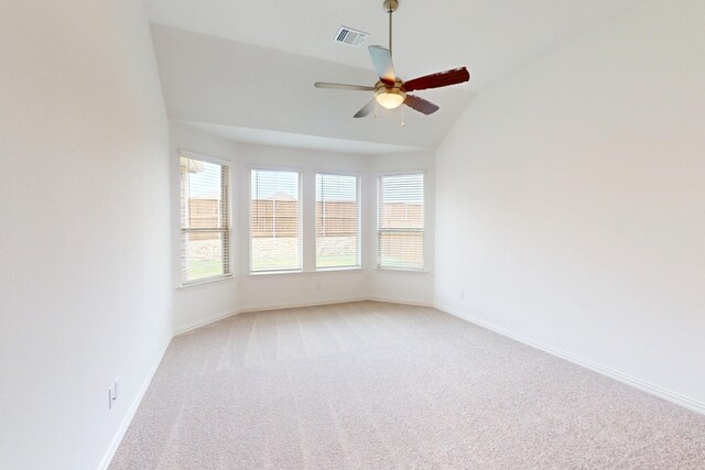 5204 Edge Way, Denton, TX 76226 - spare room featuring vaulted ceiling, light carpet, ceiling fan, and baseboards