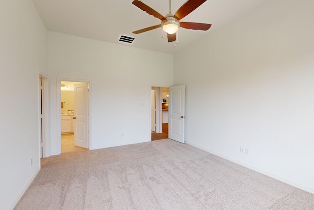 5204 Edge Way, Denton, TX 76226 - unfurnished bedroom featuring light colored carpet, high vaulted ceiling, baseboards, and connected bathroom