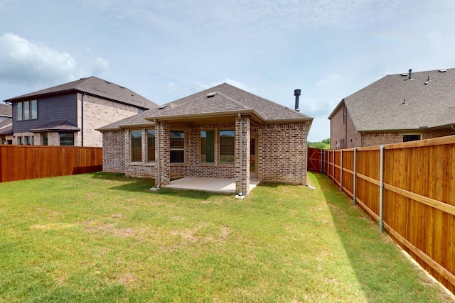 5204 Edge Way, Denton, TX 76226 - rear view of house featuring brick siding, a patio, and roof with shingles