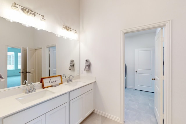 5204 Edge Way, Denton, TX 76226 - full bathroom with baseboards and double vanity