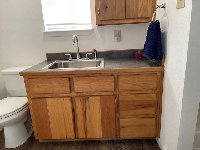 kitchen featuring dark hardwood / wood-style floors and sink