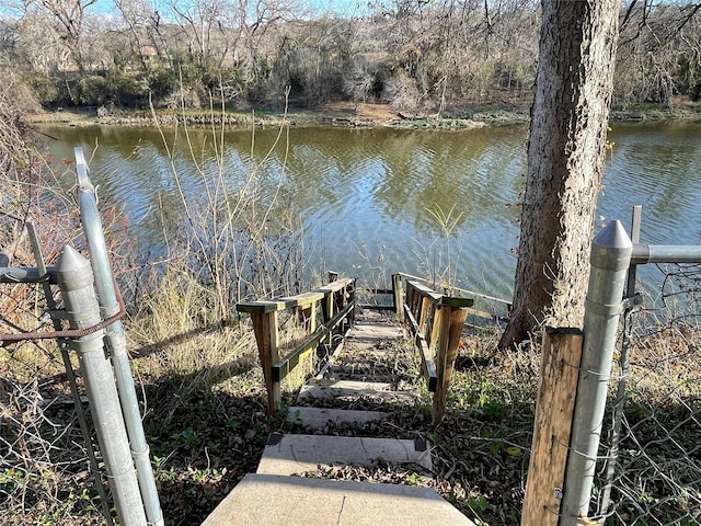 view of dock with a water view