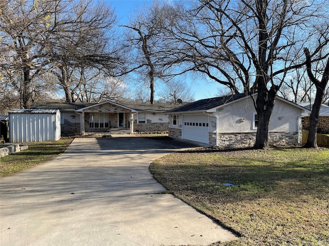 ranch-style home featuring a porch, a garage, and a front lawn