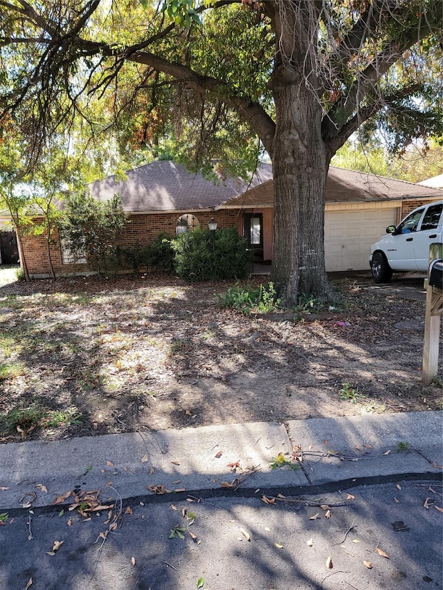 view of side of home with a garage