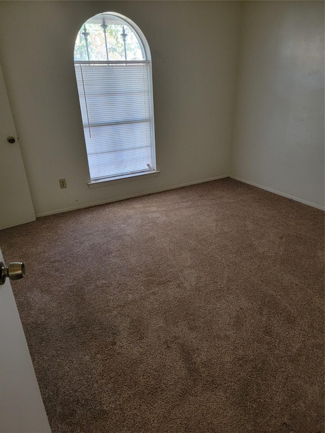 view of carpeted spare room