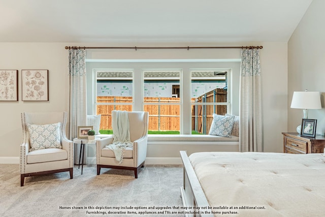 carpeted bedroom featuring multiple windows