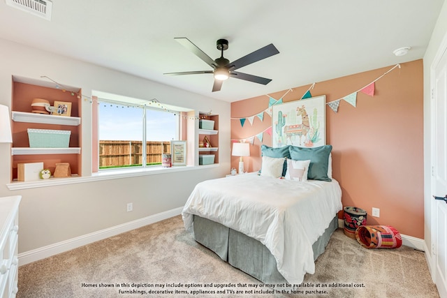 bedroom featuring ceiling fan and light carpet