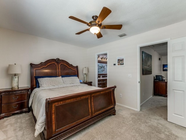 bedroom with light carpet and ceiling fan