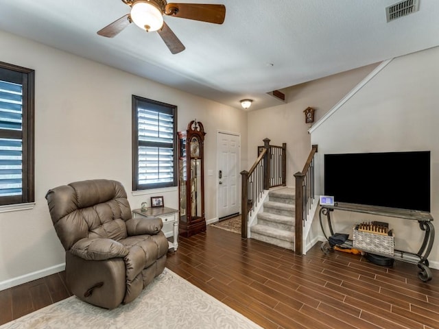 living area featuring ceiling fan