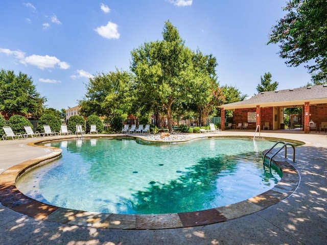 view of swimming pool featuring a patio