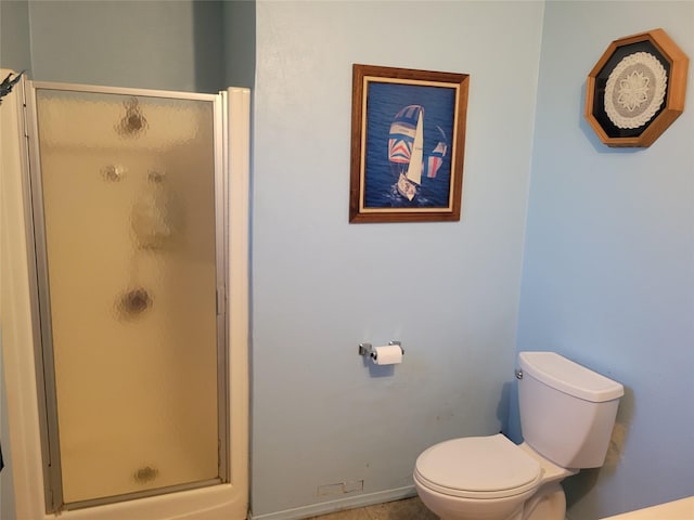 bathroom with walk in shower and toilet