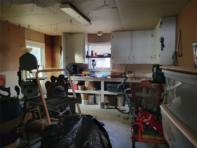 interior space with concrete flooring and a workshop area