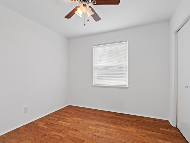 unfurnished room with hardwood / wood-style flooring and ceiling fan