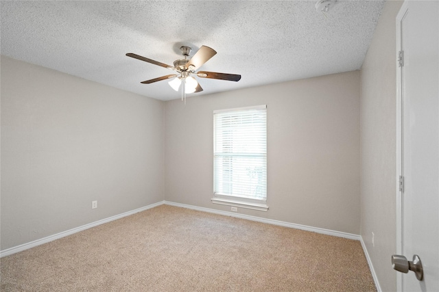 unfurnished room featuring ceiling fan, carpet floors, and a textured ceiling