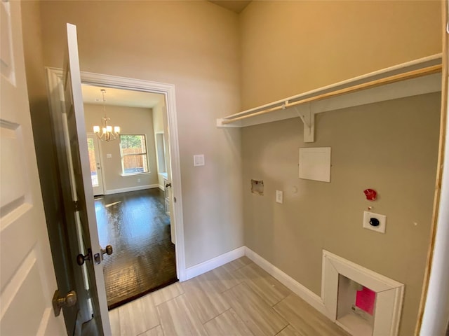 laundry room with a chandelier, hookup for a washing machine, light wood-type flooring, and electric dryer hookup