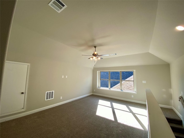 interior space featuring carpet, vaulted ceiling, and ceiling fan