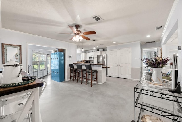 interior space with ceiling fan, crown molding, and a textured ceiling