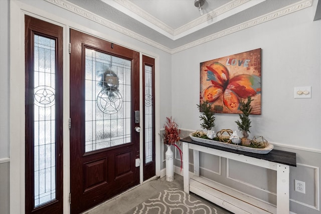 foyer featuring crown molding and plenty of natural light