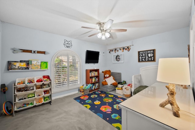 playroom featuring ceiling fan and carpet floors